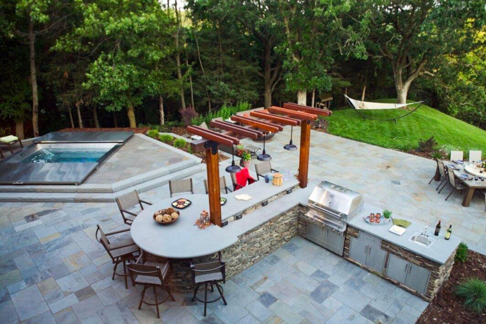 An aerial view of a patio with a table and chairs and a kitchen.