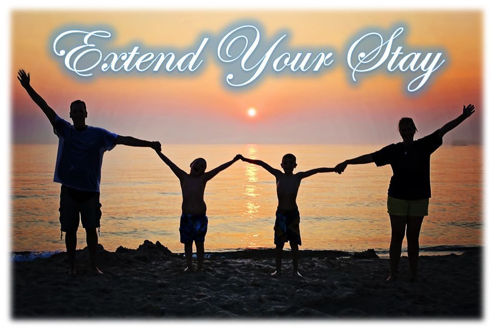 A family holding hands on a beach with the words extend your stay above them