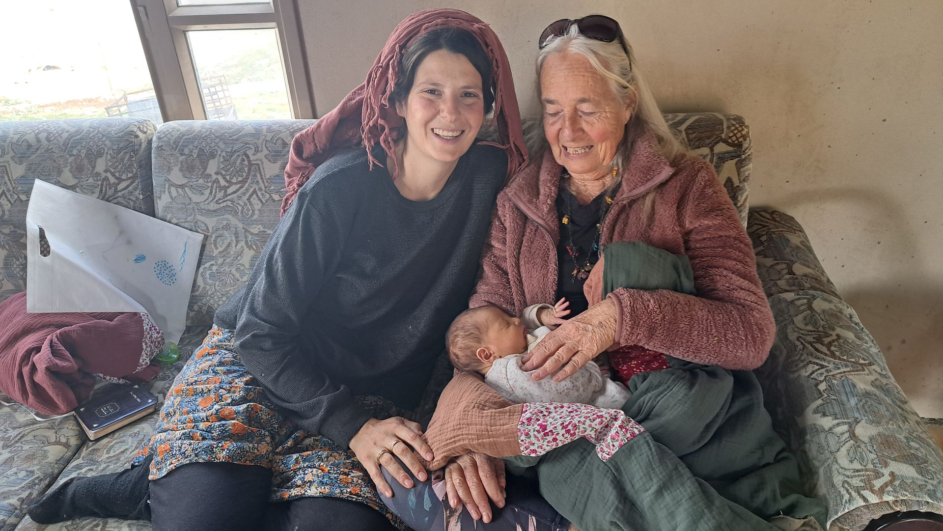 multi-generation family  
grandmother with granddaughter holding great-granddaughter