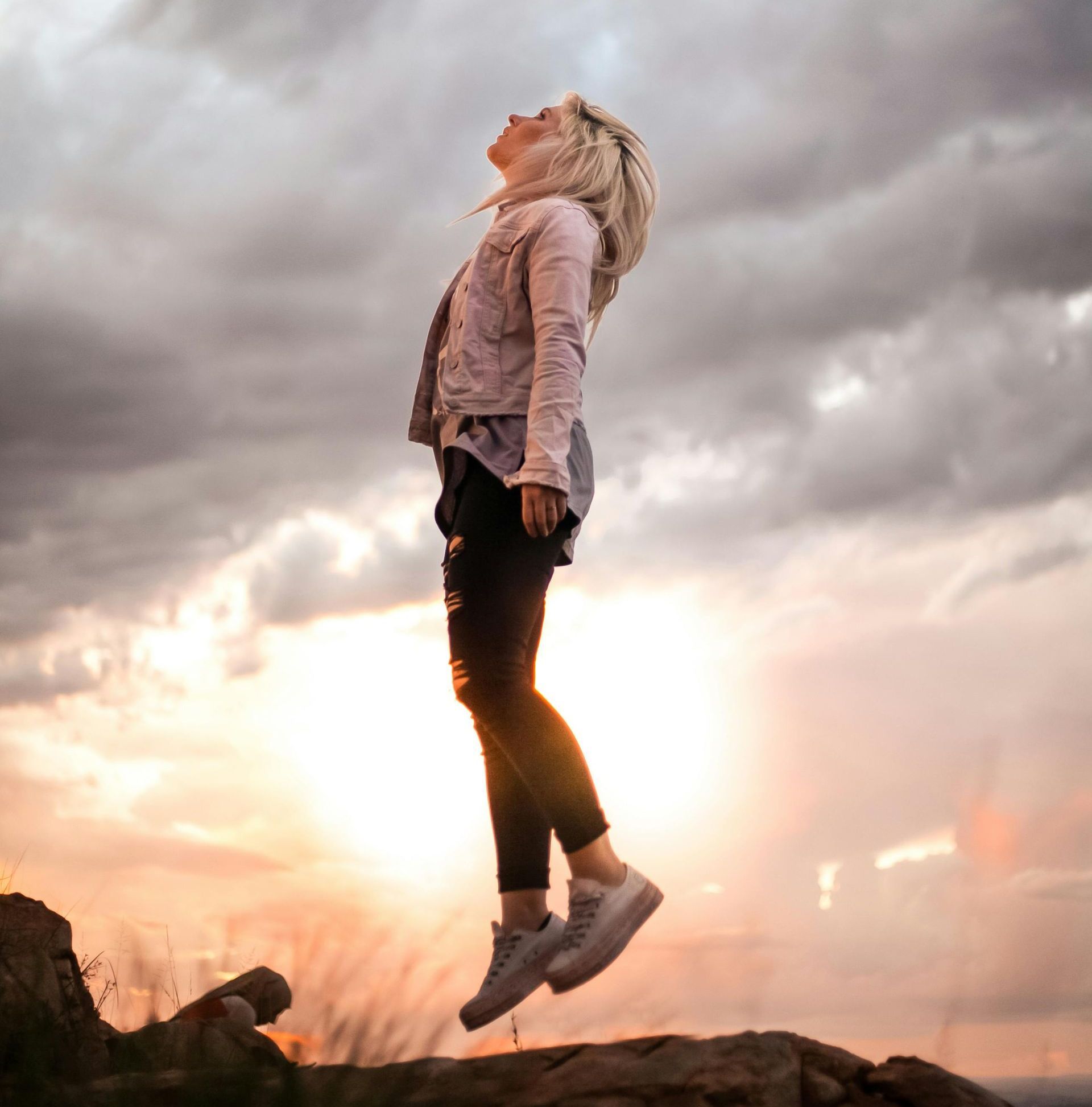 woman jumping to the sky