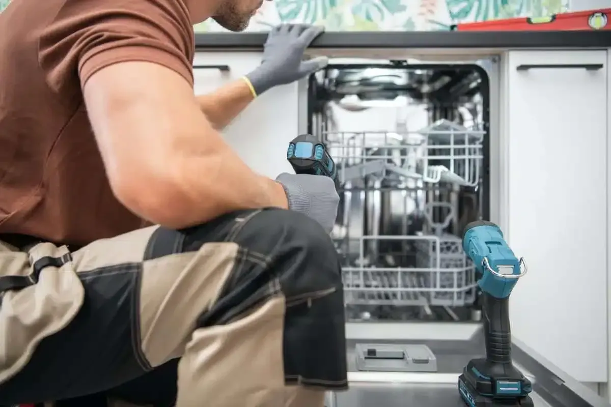 Technician replacing Dishwasher