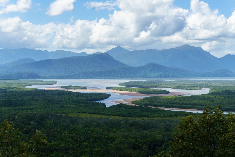 A Large Body Of Water Surrounded By Mountains And Trees — TerraModus Surveying In Atherton Tablelands, QLD