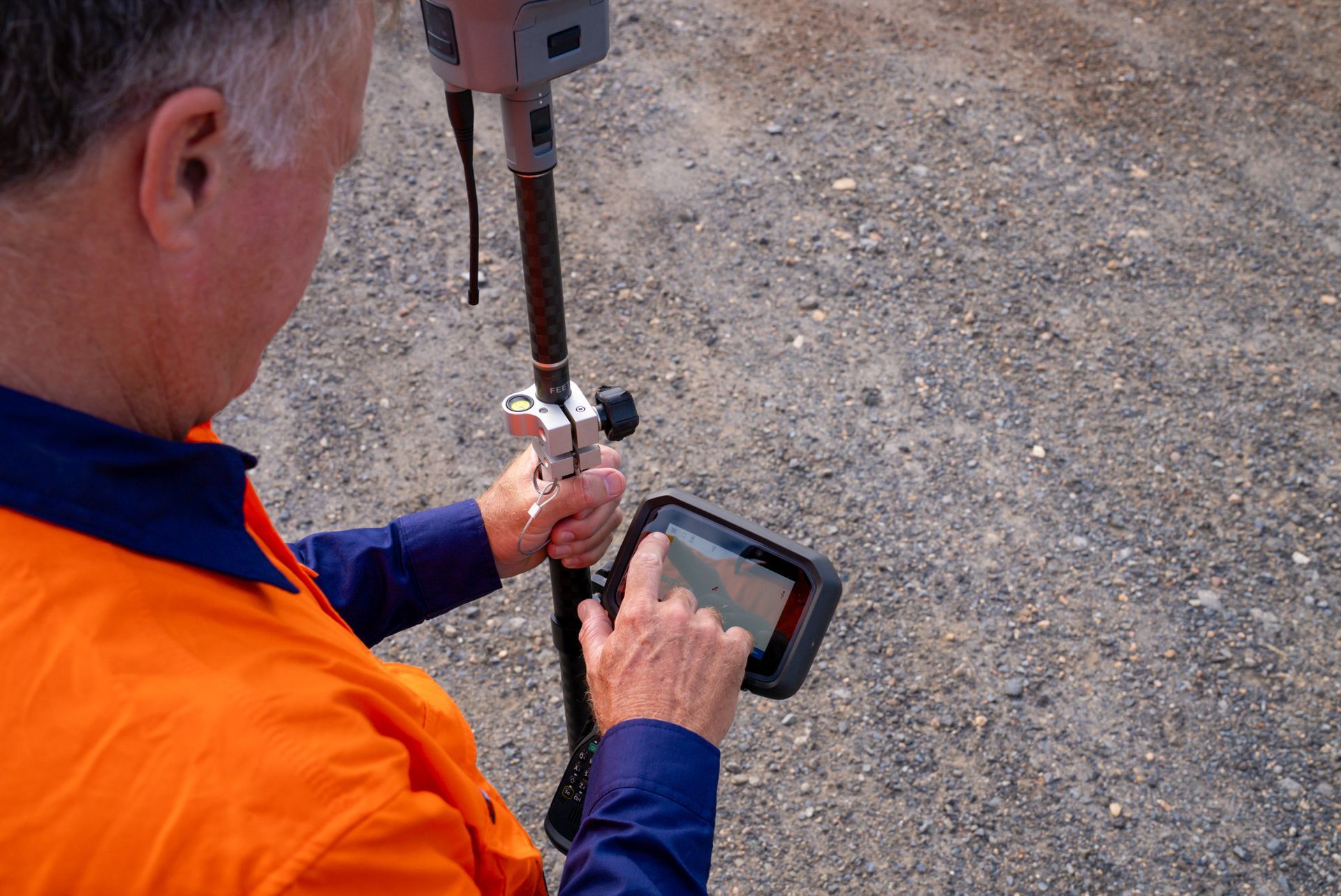 A Theodolite Is Sitting On A Tripod On A Construction Site — TerraModus Surveying In Cassowary Coast, QLD