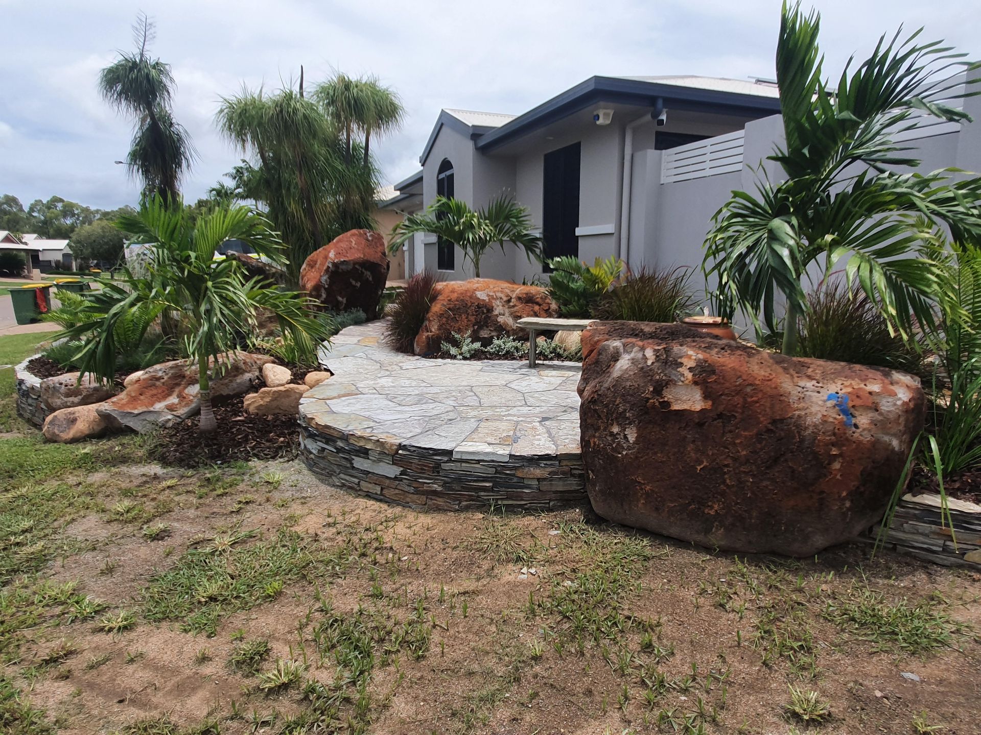 A Stone-paved Patio With Large, Rustic Boulders — High End Stone Masons in West End, QLD