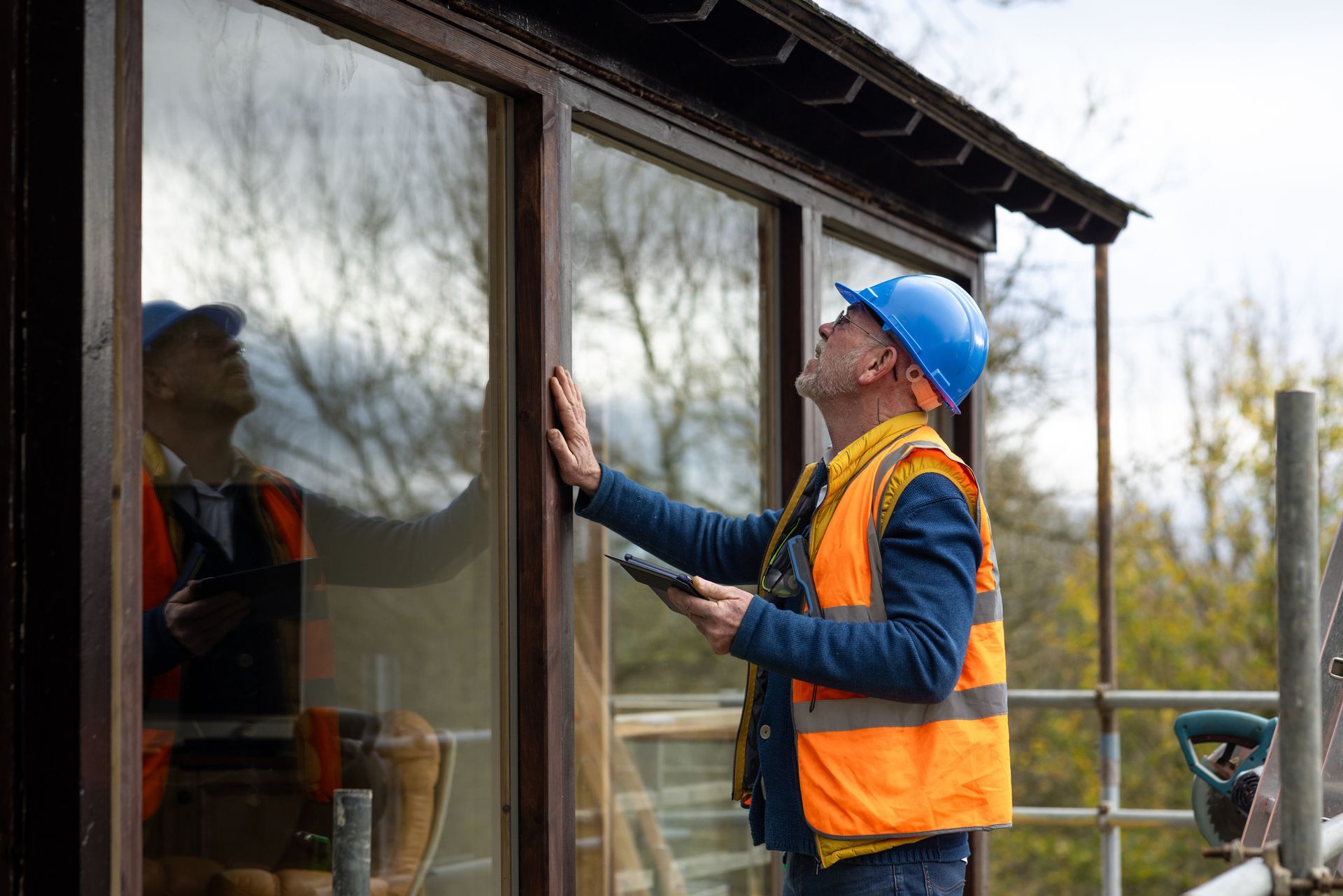 A man is inspecting the windows.
