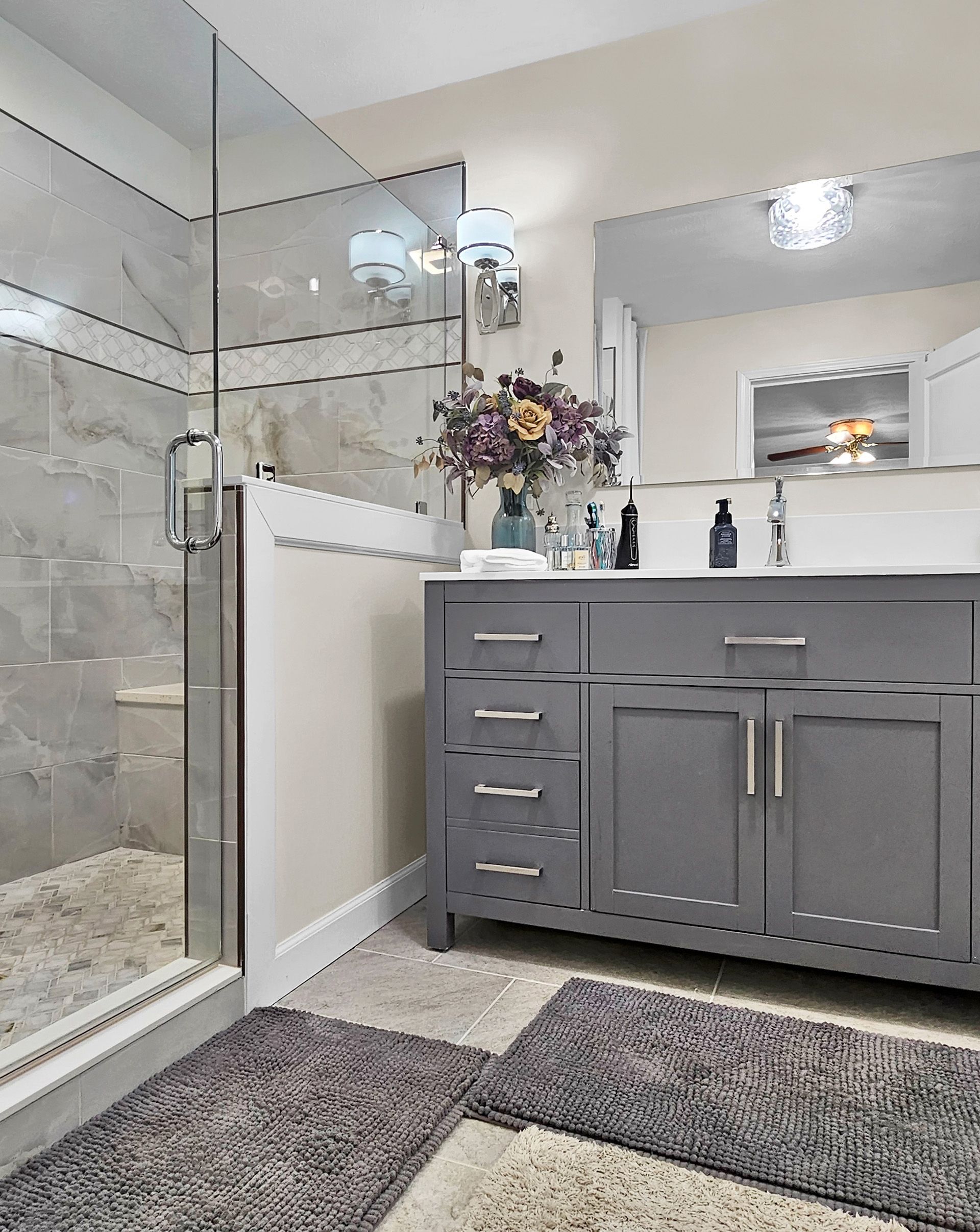 A patio with a lot of furniture and lights at night.