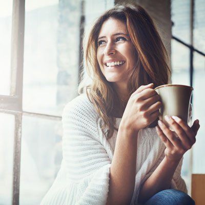 Woman Enjoying Coffee — Newton, SA — Arena Dental