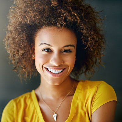 Young Lady In Yellow Shirt Smiling — Newton, SA — Arena Dental