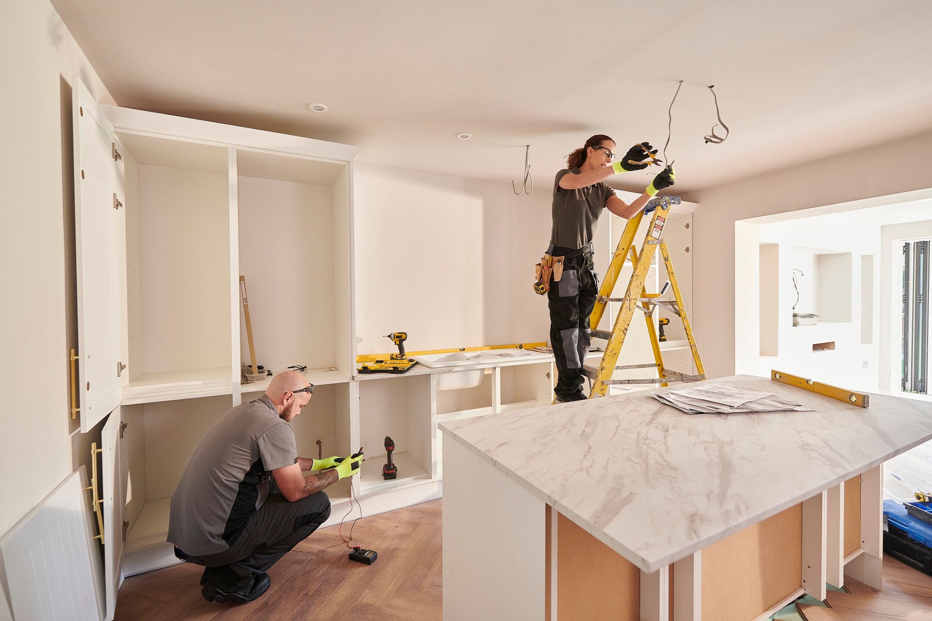 A crew is working on a kitchen remodeling project.