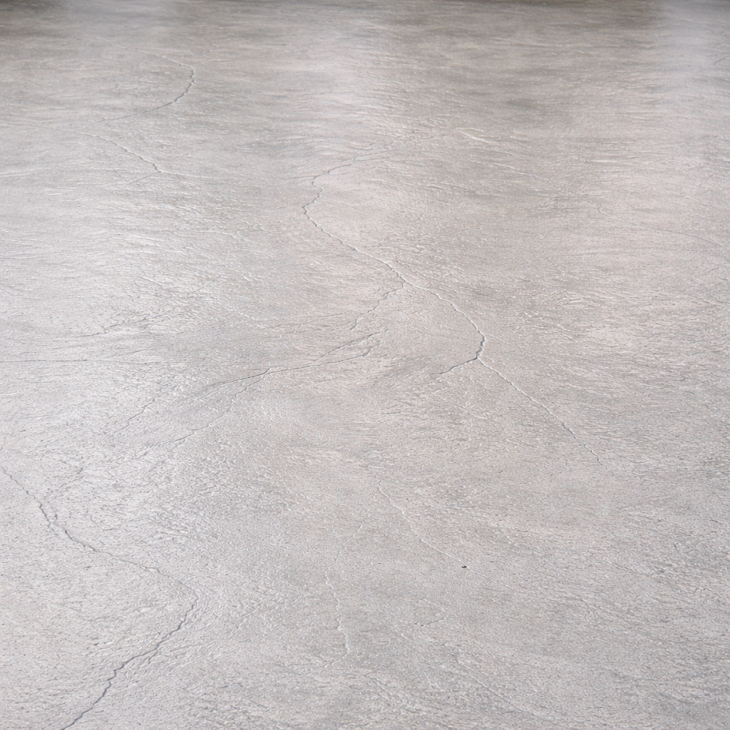 Gray concrete floor with cracks.
