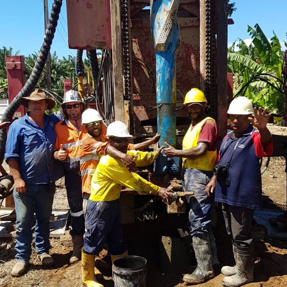 Group of Workers Around a Drilling Rig Outdoors — NRG Drilling in Kingaroy, QLD