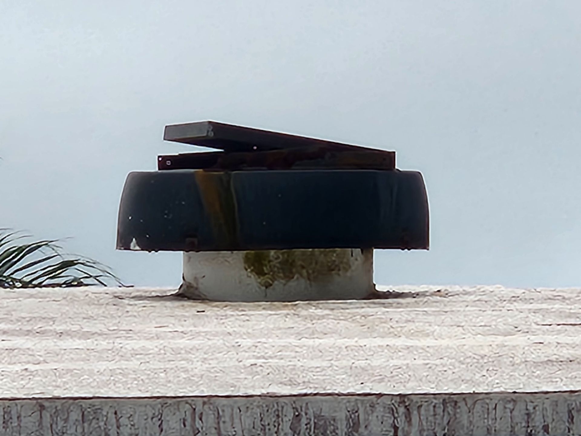 Solar attic fan on top of a roof
