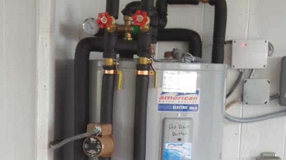 Solar water heater pump installed by Island Solar Service at residential home in Oahu