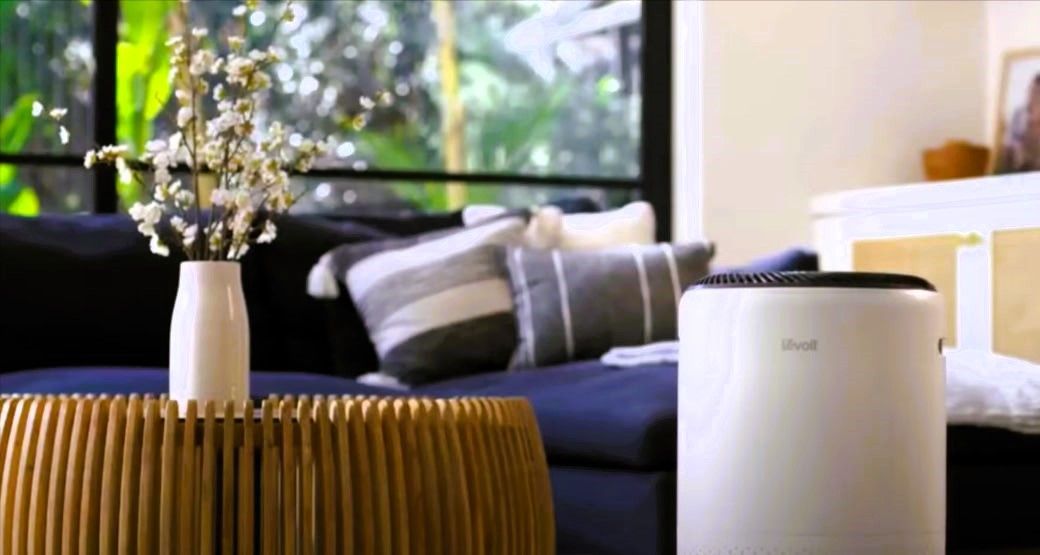 Air purifier in living room, improving indoor air quality