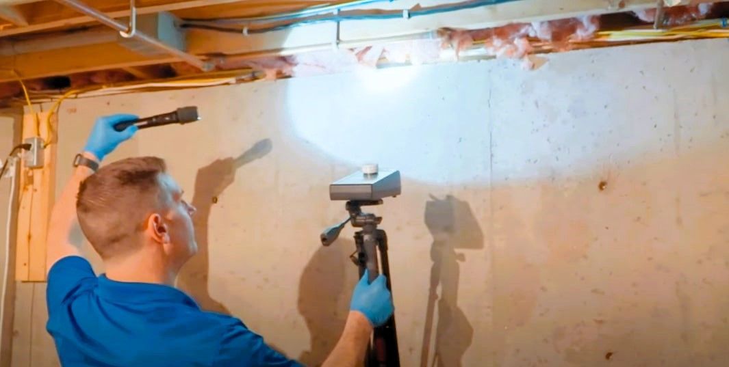 Professional inspecting mold in an old home