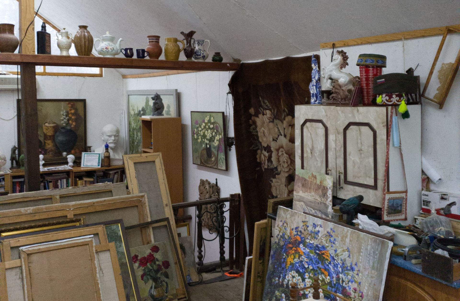 house attic full of paintings and junk