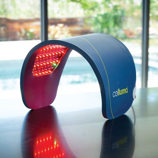 Blue and red LED Celluma light therapy device on a reflective surface.