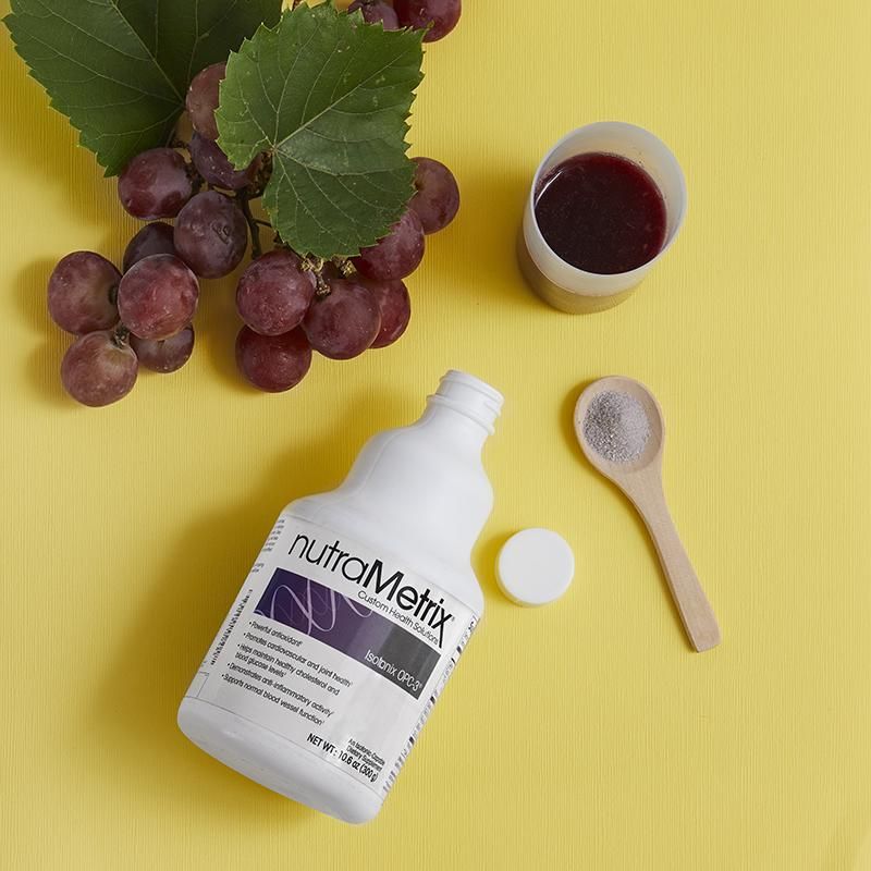 A bottle of nutrametix sits on a yellow table