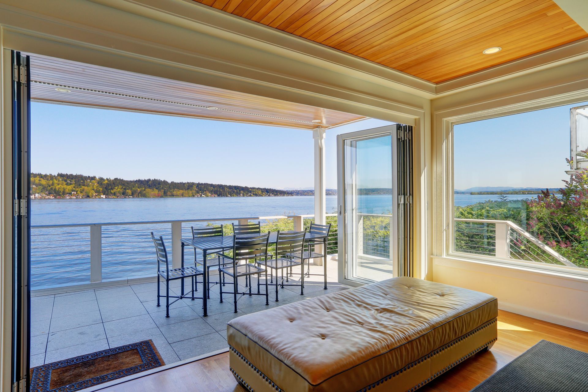 Lakefront home interior shows the covered deck. 