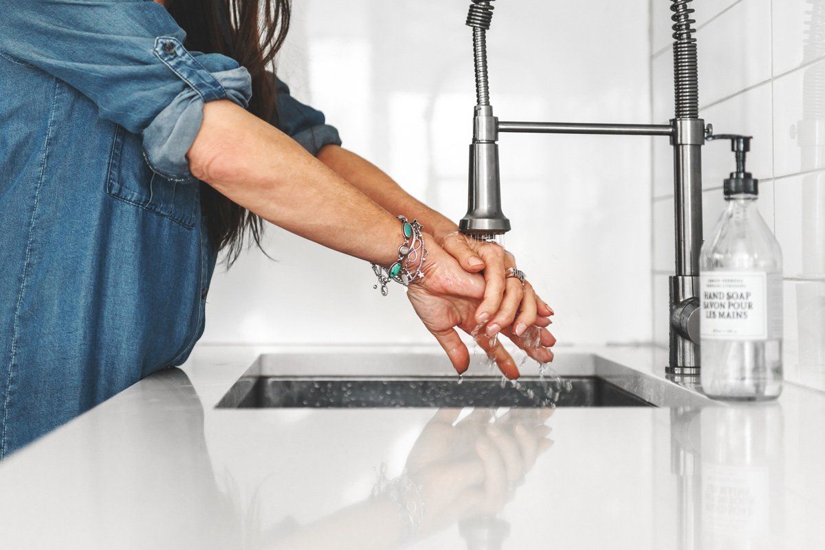 Woman Washing Her Hands — Baden, ON — Bauer Energy Design Inc