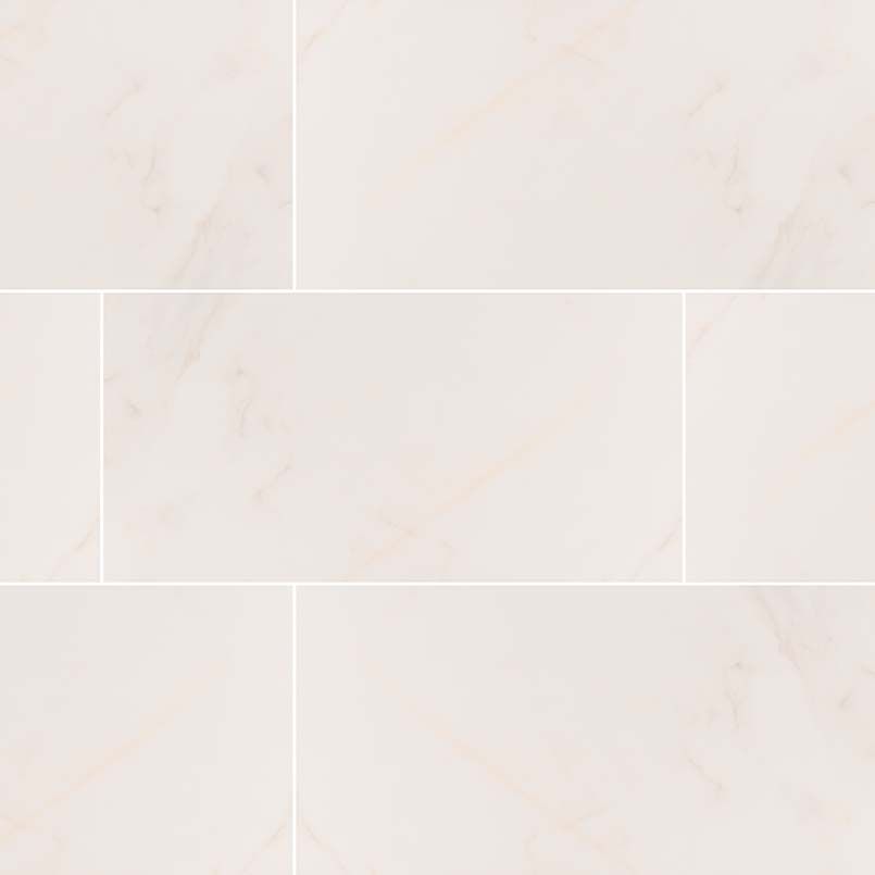 Cream-colored rectangular tiles with subtle veining, arranged in a staggered pattern.