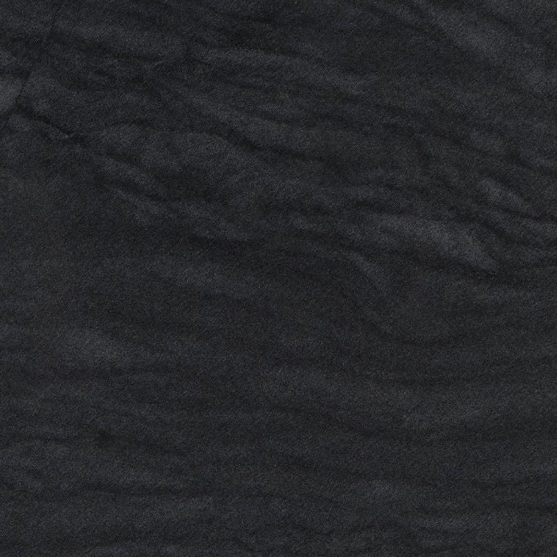 Dark gray, textured material with slight wave-like patterns.