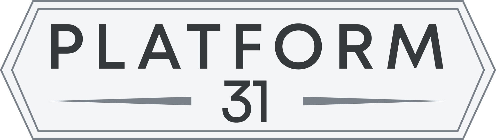 Sign for Platform 31, a white and gray geometric shape with the words "PLATFORM 31."
