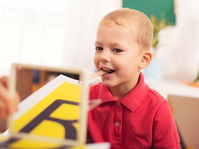 Occupational Therapy — Speech therapist Teaches the Boy in Flint Township, MI