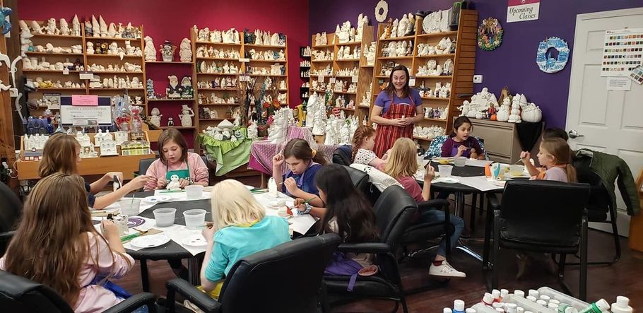 A payless shoesource store with a blue awning