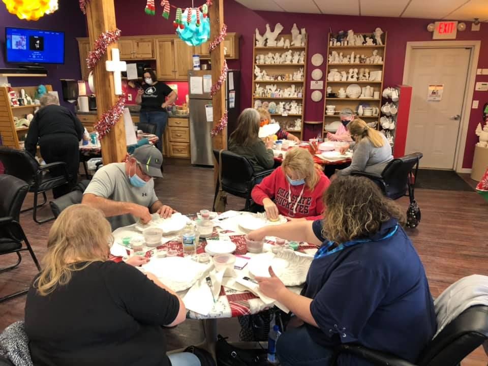A payless shoesource store with a blue awning