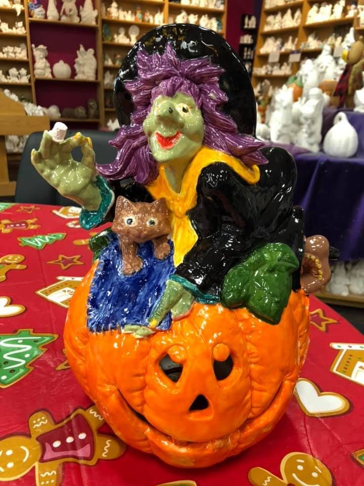 White car wheel well with air suspension installed; brake rotor, caliper, and suspension components visible.