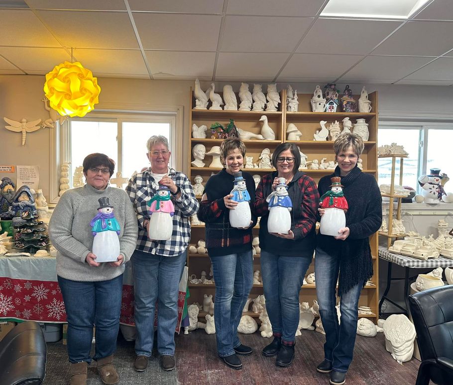A payless shoesource store with a blue awning