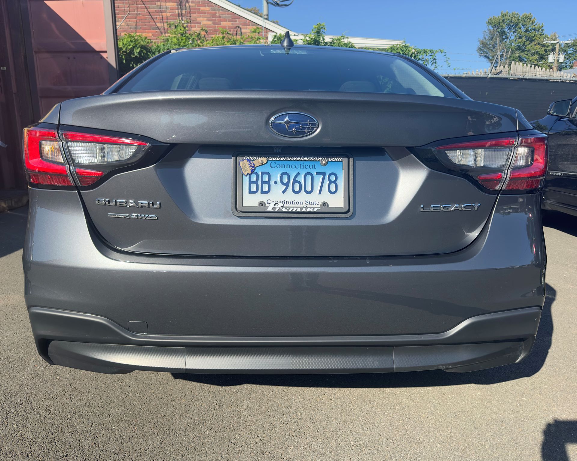 A gray car with a license plate that says bb 96078