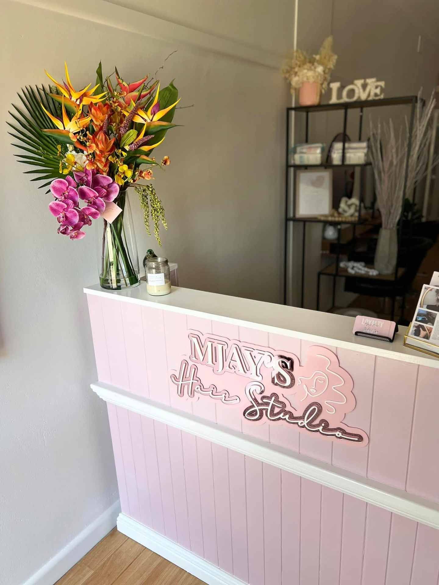 A Little Girl Is Wearing A Braided Ponytail With Pink And Purple Hair Extensions — Mjay's Hair Studio & Spa In Dubbo, NSW