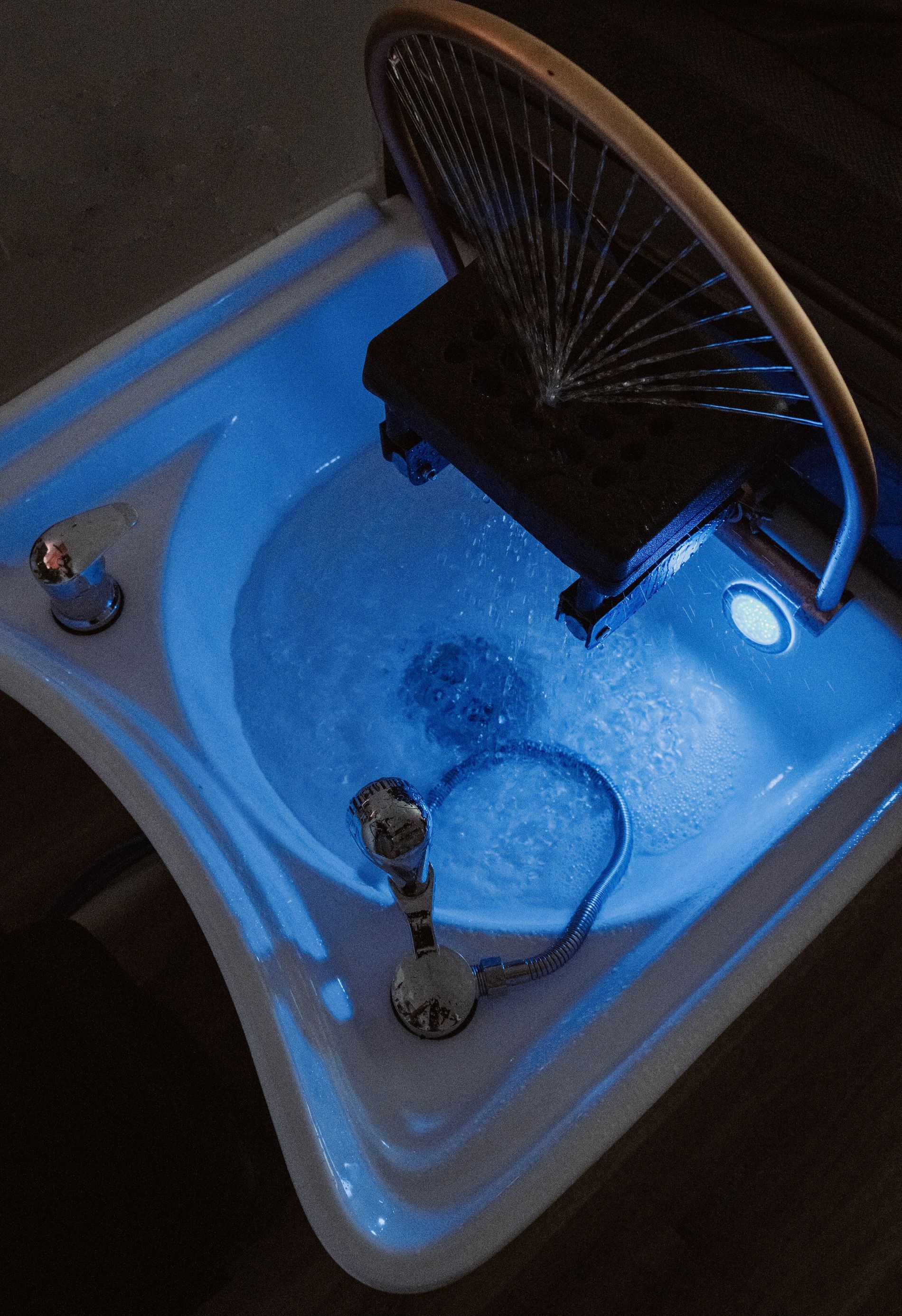 A bathroom sink with blue lights on it — Mjay's Hair Studio & Spa In Dubbo, NSW
