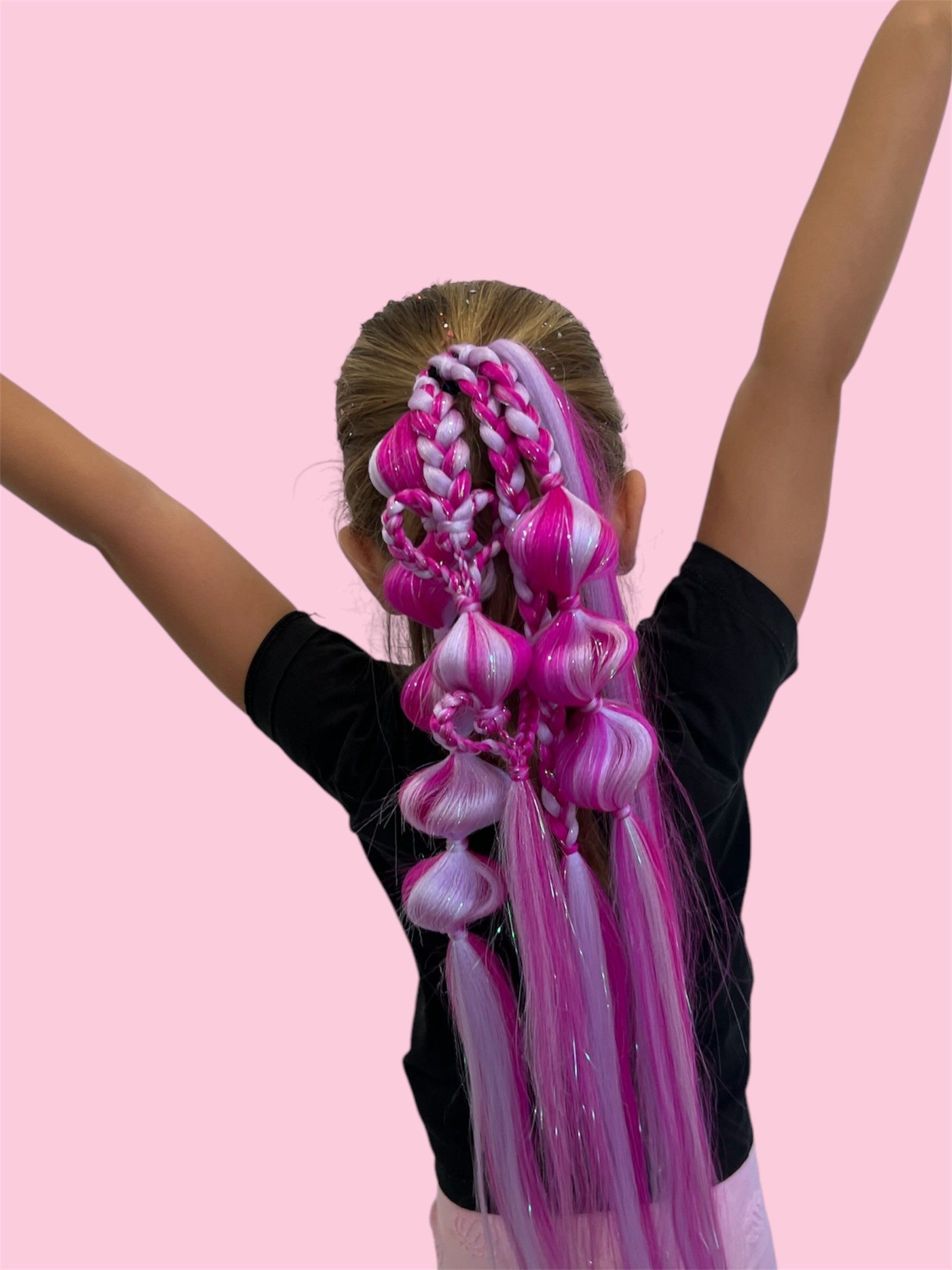 A Woman With Long Blonde Hair Is Sitting In A Chair In A Salon — Mjay's Hair Studio & Spa In Dubbo, NSW