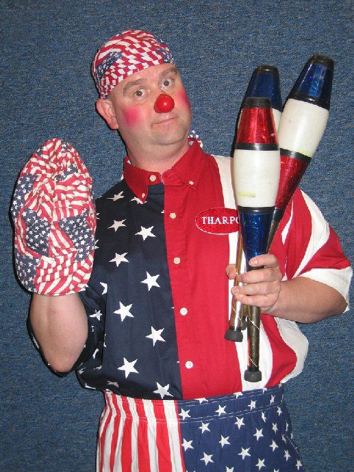A man wearing a red white and blue shirt with the word thorn on it