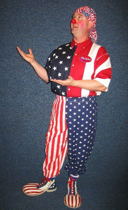 A clown is wearing a red white and blue outfit