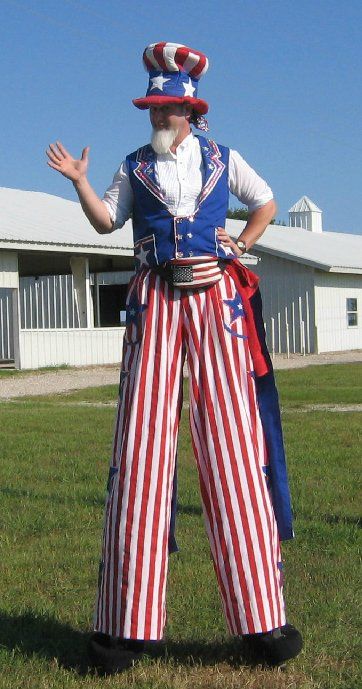 A man on stilts dressed as uncle sam