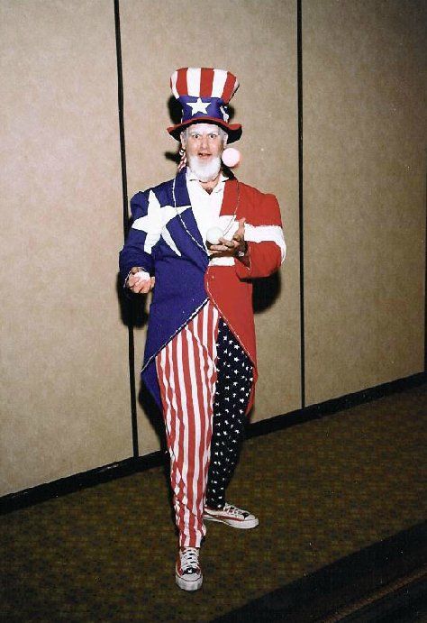 A man dressed as uncle sam is holding a star