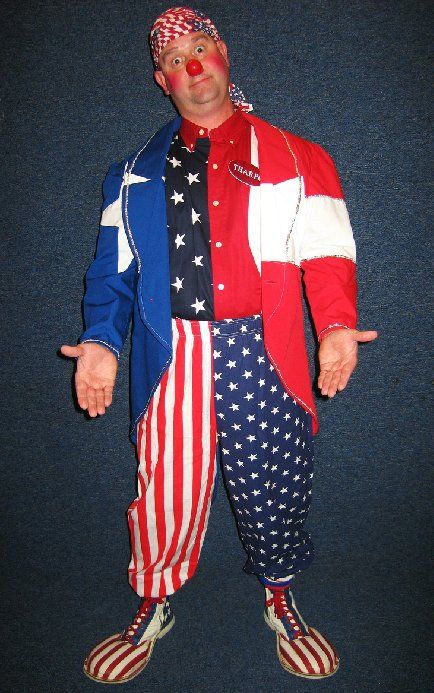 A clown is wearing a red white and blue outfit