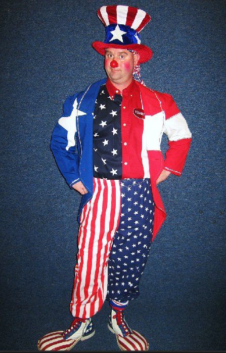 A clown dressed as uncle sam is standing with his hands on his hips