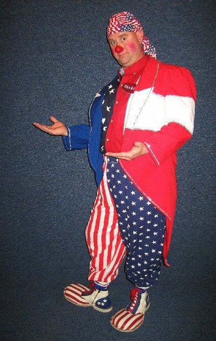 A clown is wearing a red white and blue outfit