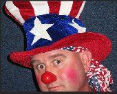 A man wearing an uncle sam hat and a red nose.