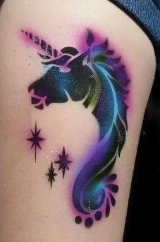 A person has a tattoo of a unicorn on their arm