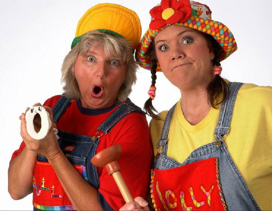 Two women dressed up as clowns holding numbers 0 and 0