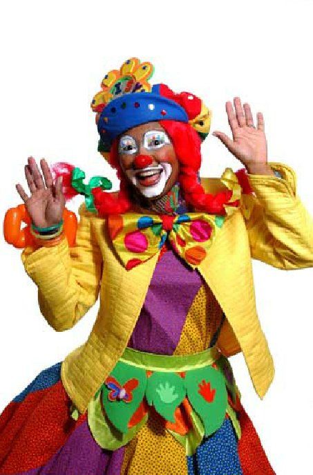 A woman dressed as a clown with balloons in her hair