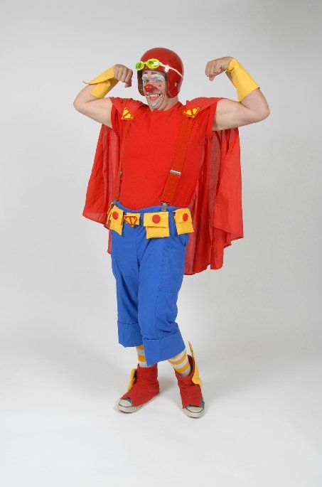 A man in a superhero costume is flexing his muscles