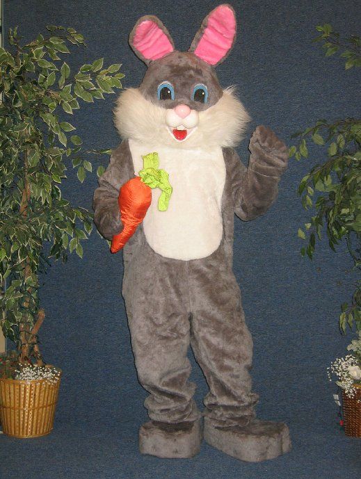 A bunny mascot is holding a carrot in his hand