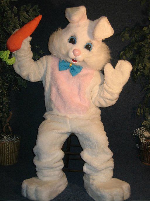 A bunny mascot is holding a carrot in his hand